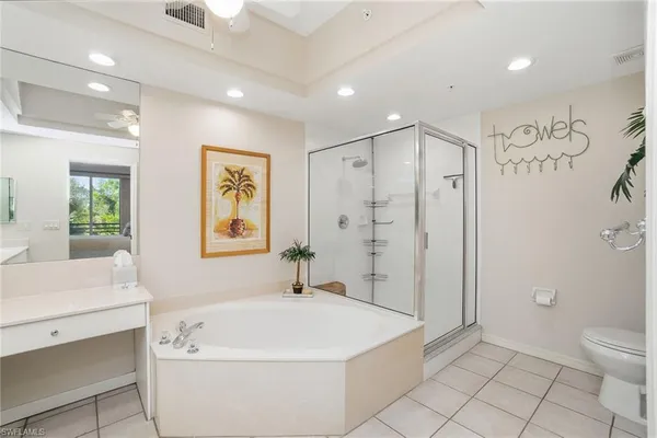 a bathroom with a bathtub a toilet a sink and a shower
