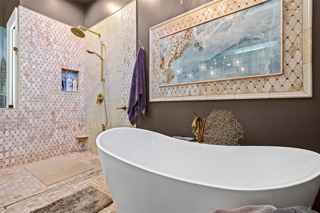 8908 Brierfield Road Granbury, TX 76049 - Photo 21 of 40 a bathroom with a bathtub and a shower
