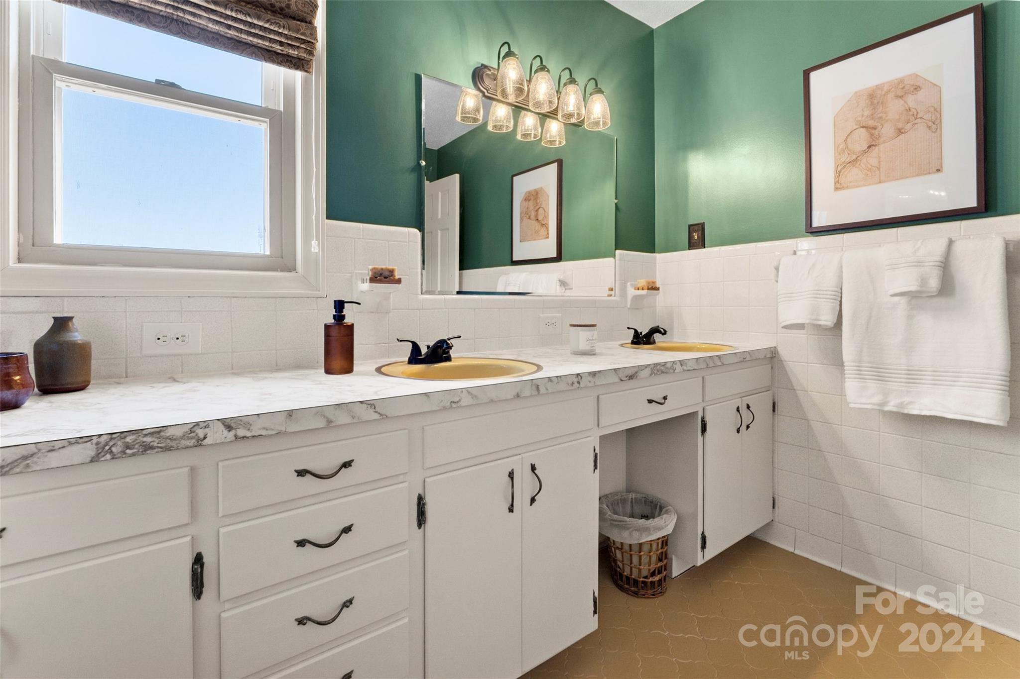 10845 Traphill Road Traphill, NC 28685 - Photo 20 of 48 a bathroom with a double vanity sink and a mirror