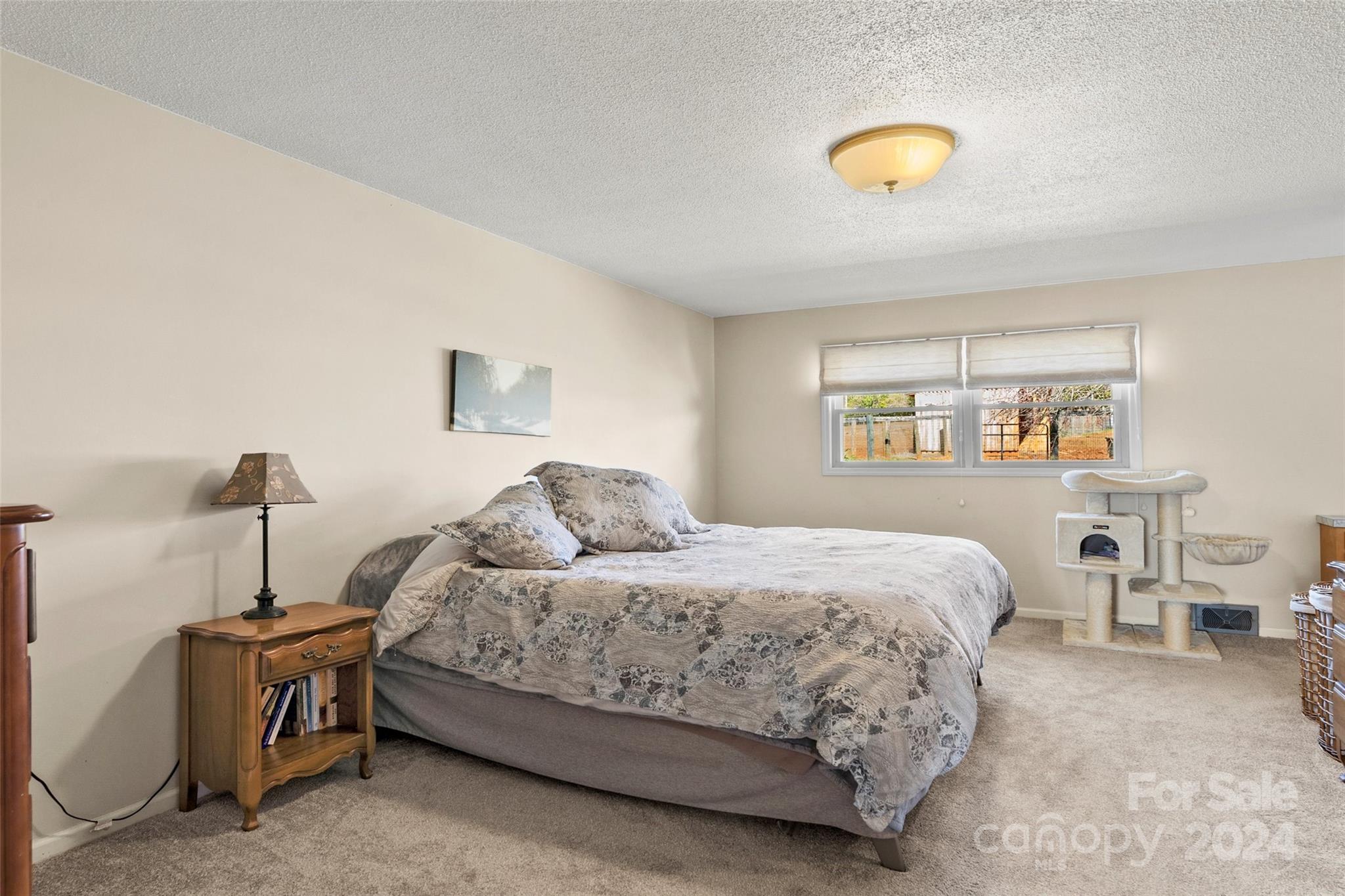 10845 Traphill Road Traphill, NC 28685 - Photo 21 of 48 a bedroom with a bed and a lamp