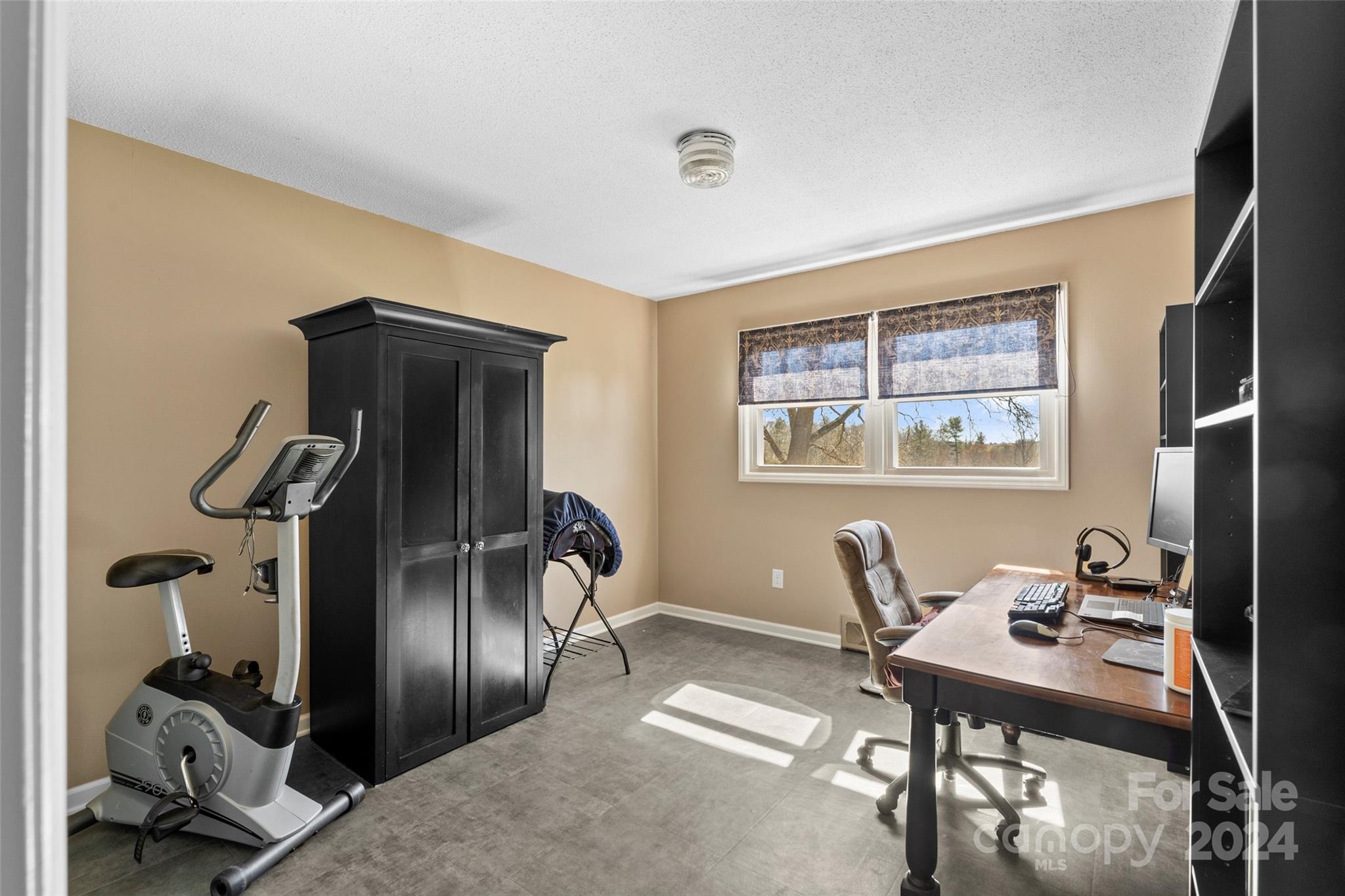 10845 Traphill Road Traphill, NC 28685 - Photo 25 of 48 a view of a workspace with furniture and a window