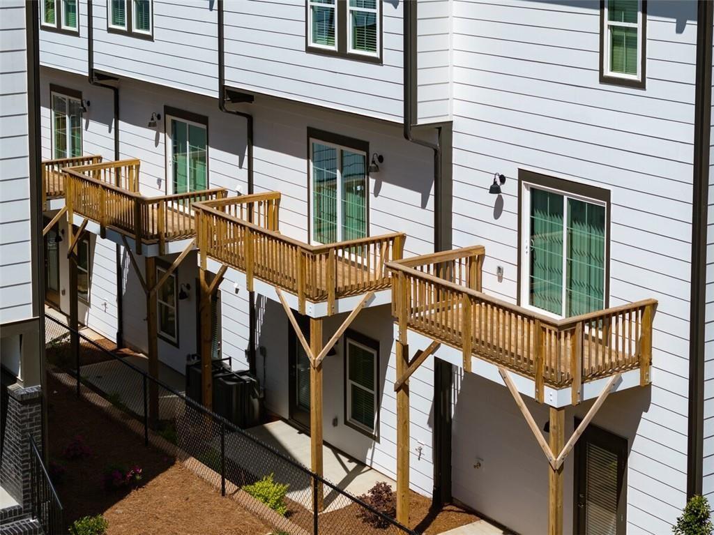 3960 Redan Road, Unit C1 Stone Mountain, GA 30083 - Photo 4 of 23 a view of a house with a wooden deck