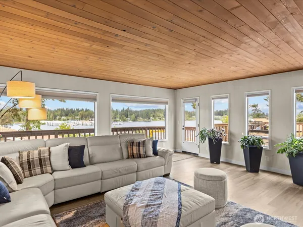 a view of a balcony with two chairs and a potted plant