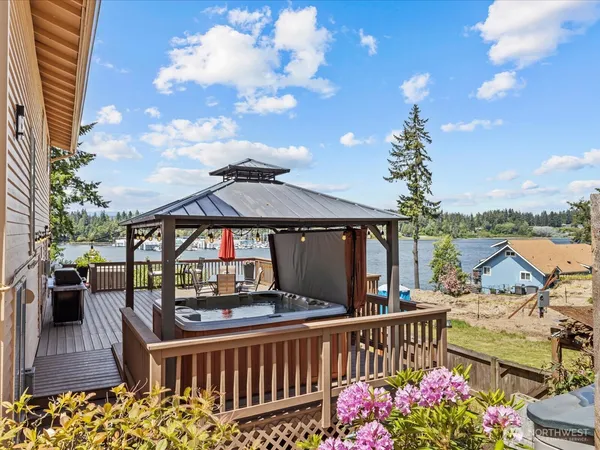 a view of a balcony with wooden floor and outdoor space