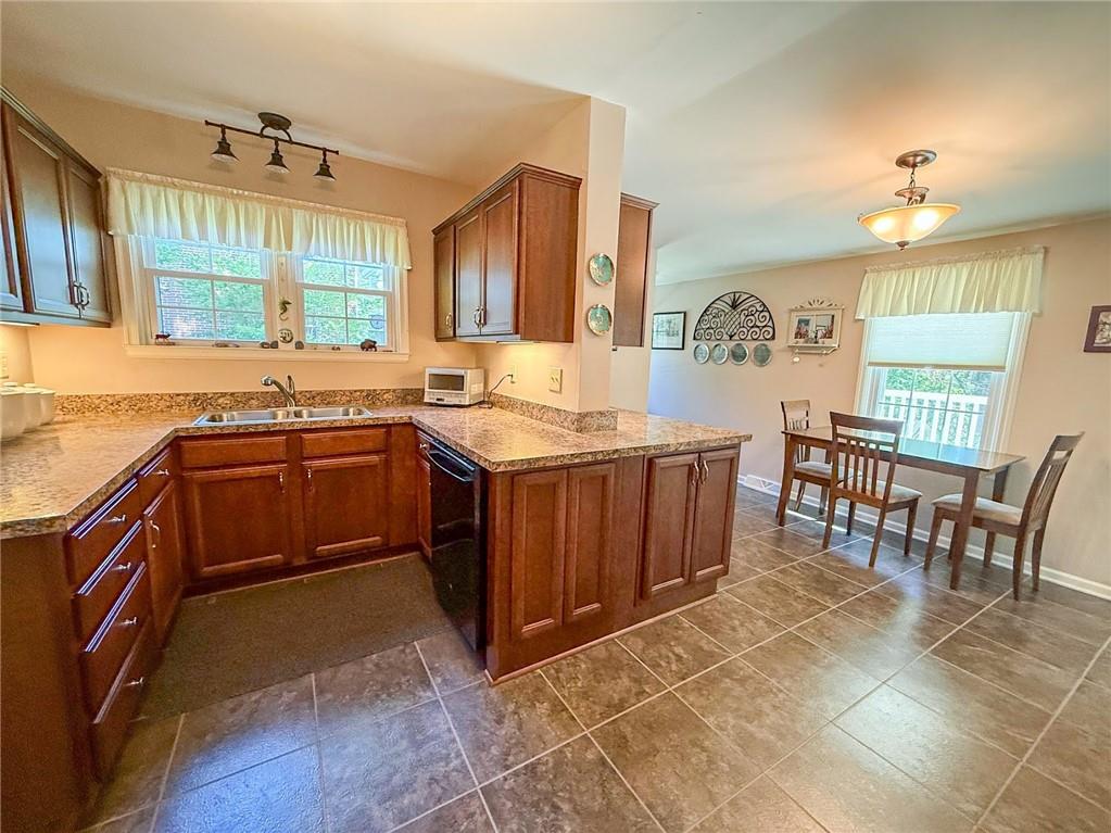 306 Beechwood Boulevard Butler, PA 16001 - Photo 16 of 40 a kitchen with a sink stove and cabinets