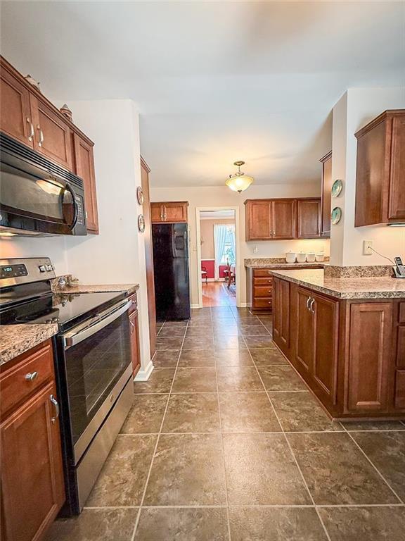 306 Beechwood Boulevard Butler, PA 16001 - Photo 18 of 40 a large kitchen with stainless steel appliances and a stove top oven