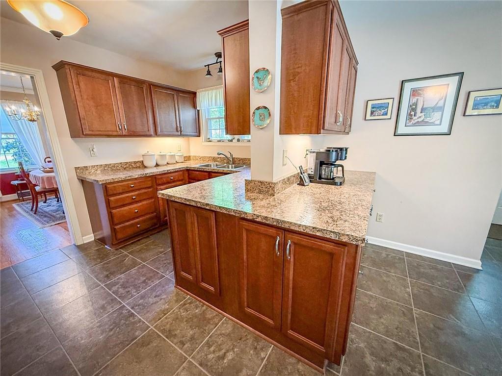 306 Beechwood Boulevard Butler, PA 16001 - Photo 19 of 40 a kitchen with stainless steel appliances granite countertop a sink stove and cabinets