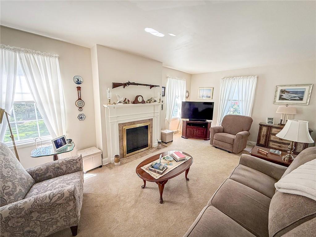 306 Beechwood Boulevard Butler, PA 16001 - Photo 4 of 40 a living room with furniture a rug and a fireplace