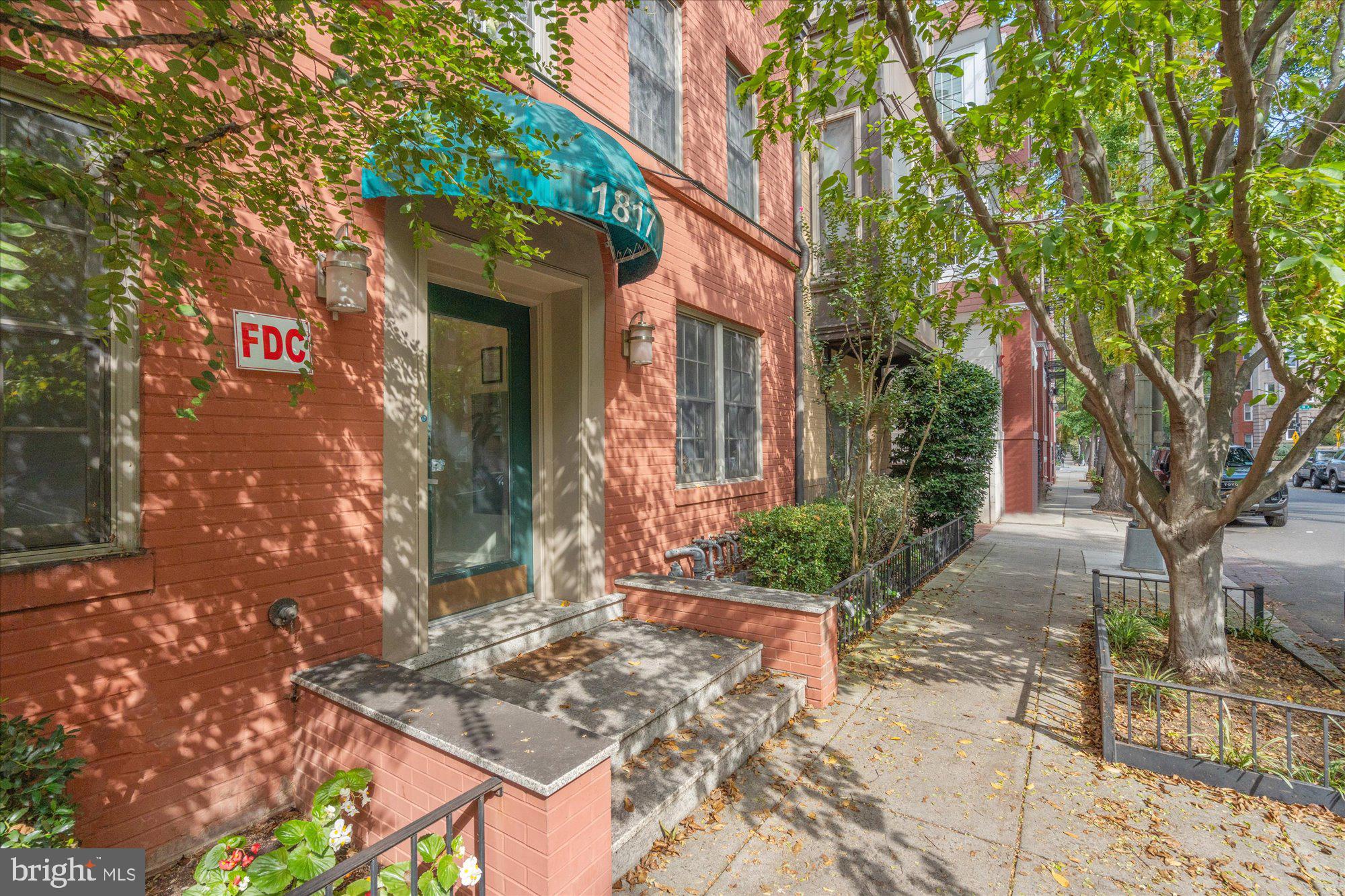 1817 Swann Street Northwest, Unit B Washington, DC 20009 - Photo 1 of 34 front view of a house with a tree