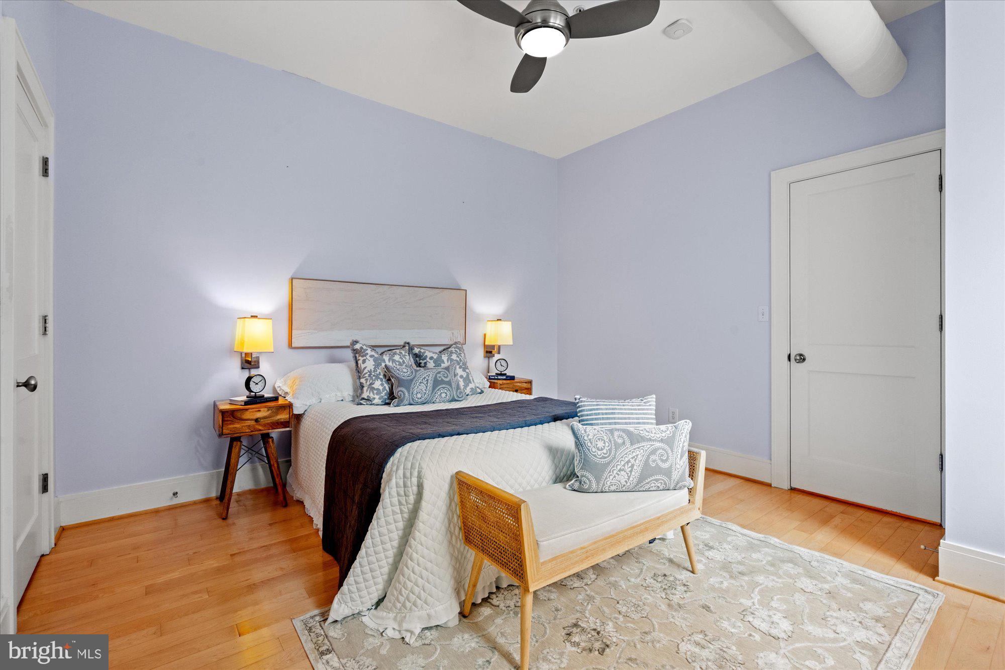 1817 Swann Street Northwest, Unit B Washington, DC 20009 - Photo 13 of 34 a bedroom with a bed and wooden floor