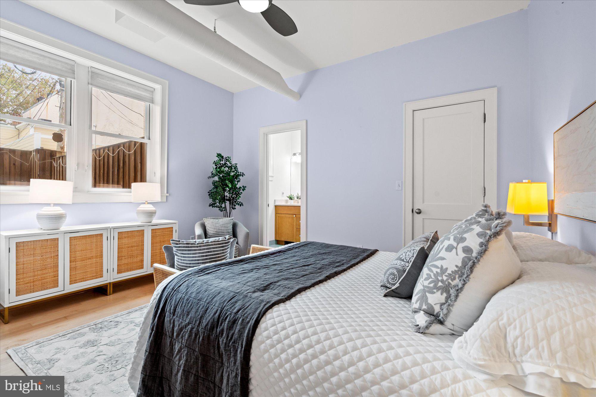 1817 Swann Street Northwest, Unit B Washington, DC 20009 - Photo 14 of 34 a bedroom with a bed and a large window