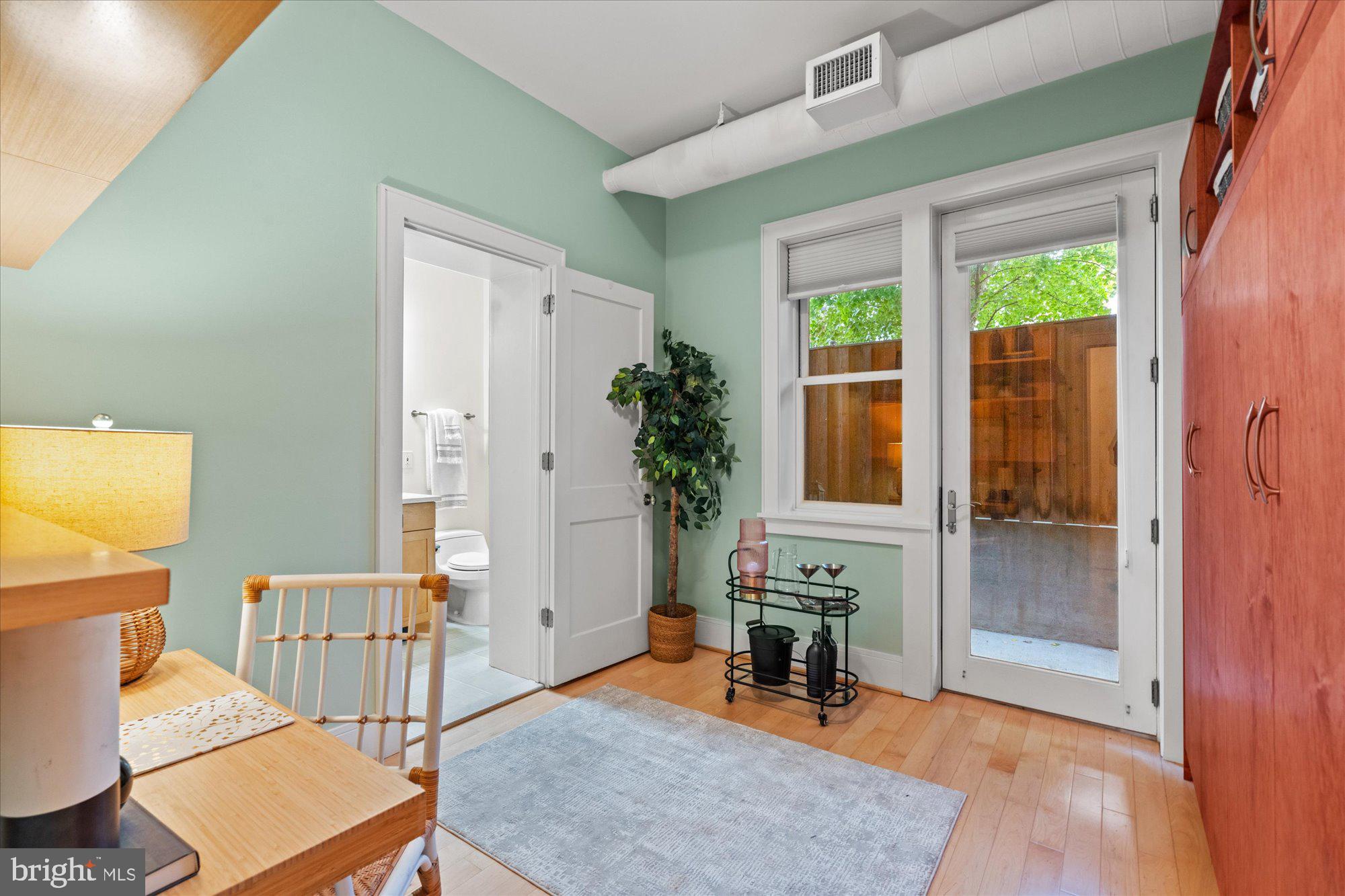 1817 Swann Street Northwest, Unit B Washington, DC 20009 - Photo 19 of 34 a living room with furniture and a window