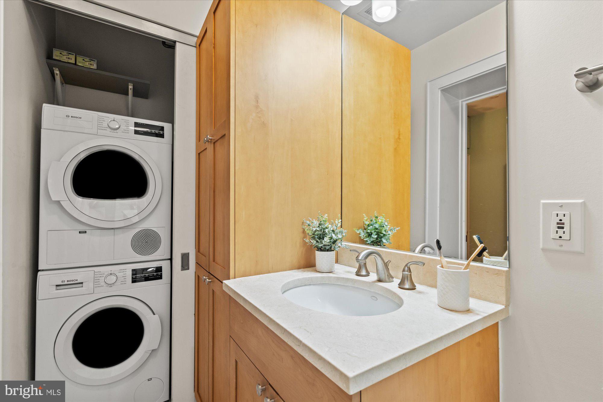 1817 Swann Street Northwest, Unit B Washington, DC 20009 - Photo 22 of 34 a bathroom with a sink and a washer