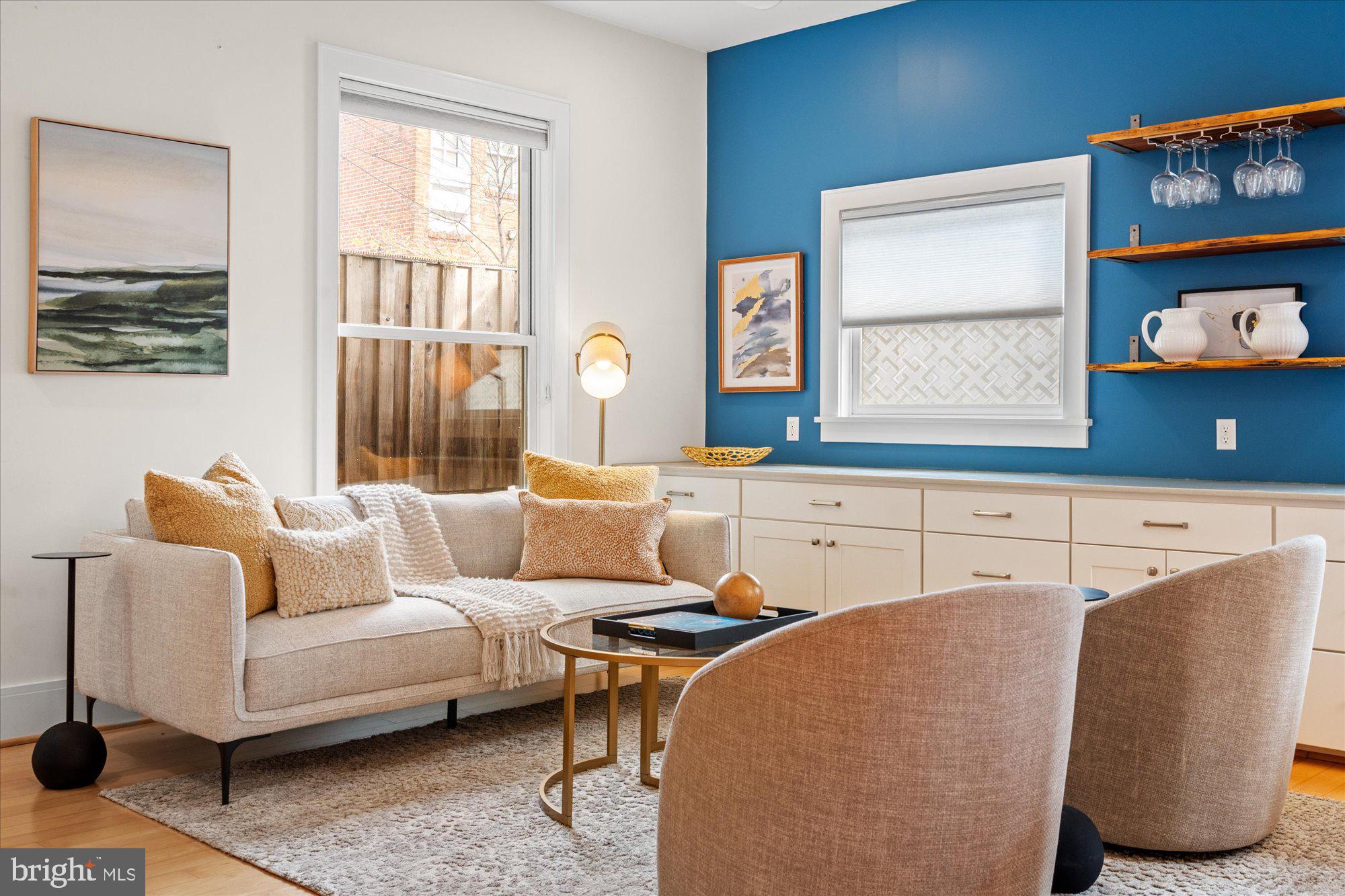 1817 Swann Street Northwest, Unit B Washington, DC 20009 - Photo 3 of 34 a living room with furniture and a window
