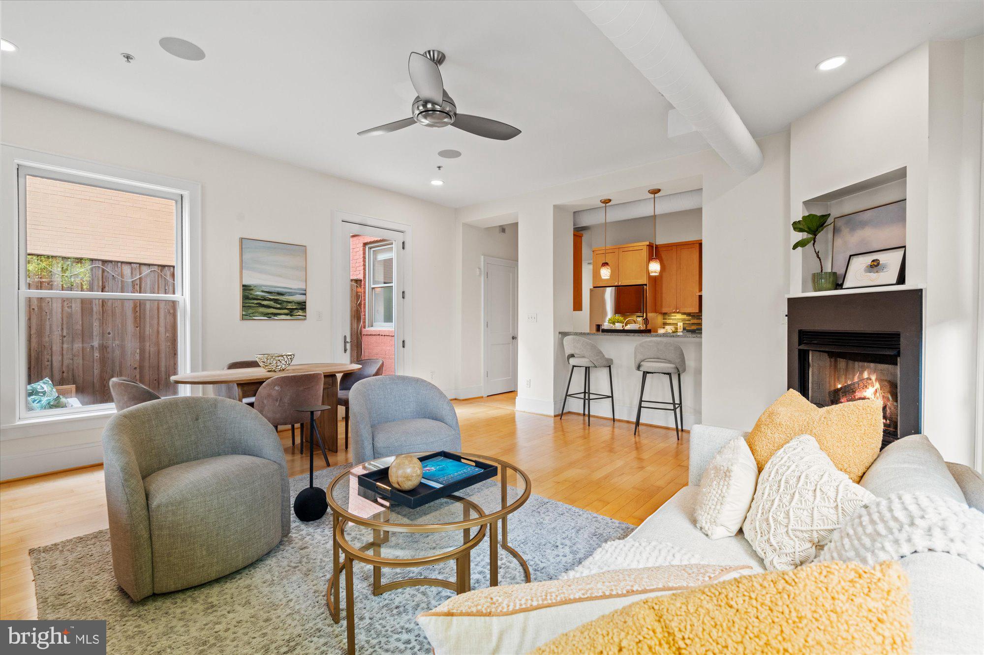 1817 Swann Street Northwest, Unit B Washington, DC 20009 - Photo 7 of 34 a living room with furniture and a flat screen tv
