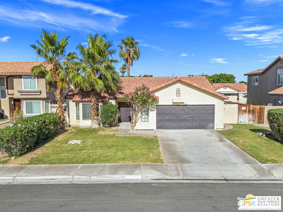 45688 Sutter Creek Road Indio, CA 92201 - Photo 50 of 51 a front view of a house with a yard and garage