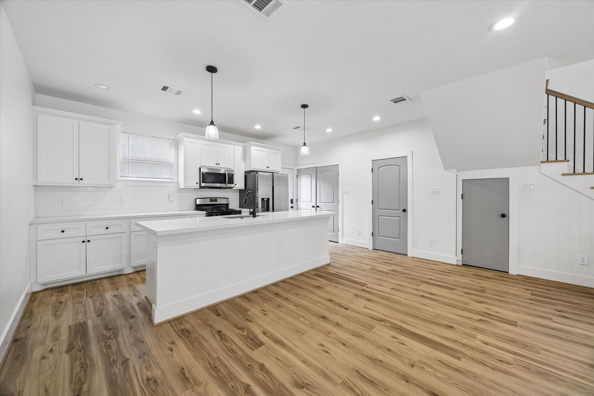 2749 Redrock Street, Unit B Houston, TX 77088 - Photo 8 of 24 The kitchen includes plenty of storage cabinetry, crown moulding, soft-close cabinets & drawers, subway tiled back splash, and all appliances included.