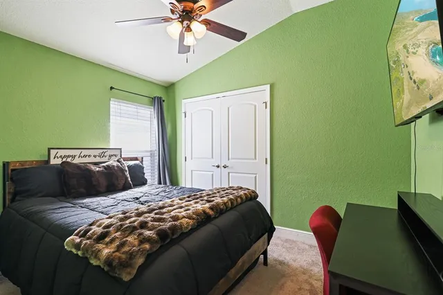 a bedroom with a bed and window