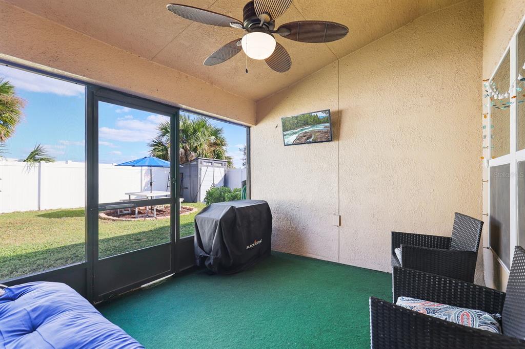 14510 Haddon Mist Drive Wimauma, FL 33598 - Photo 24 of 39 a living room with furniture and a floor to ceiling window