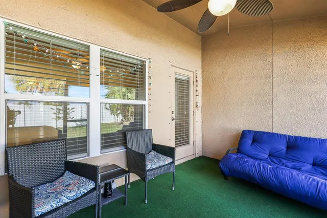 a living room with furniture and a window
