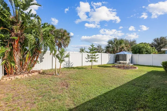 a small yard with a fountain