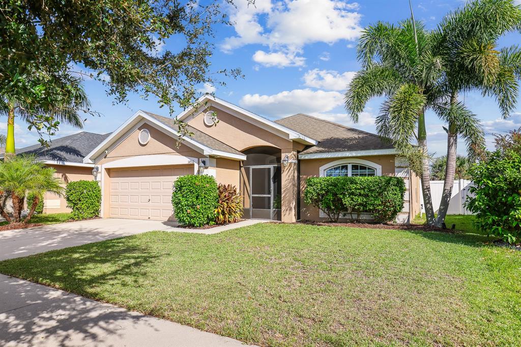 14510 Haddon Mist Drive Wimauma, FL 33598 - Photo 29 of 39 a front view of a house with a yard and garage