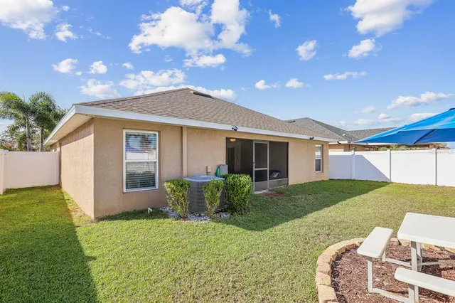a view of backyard with a garden and plants