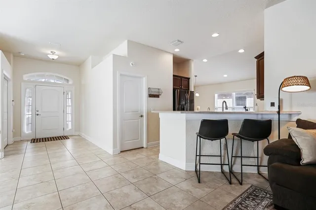 a kitchen with a dining table and chairs