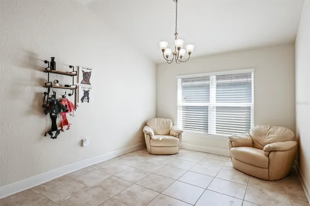 a view of a livingroom with furniture and a window