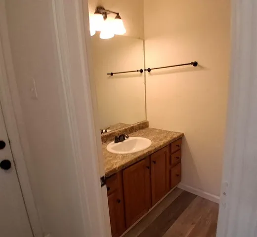 a bathroom with a sink and mirror