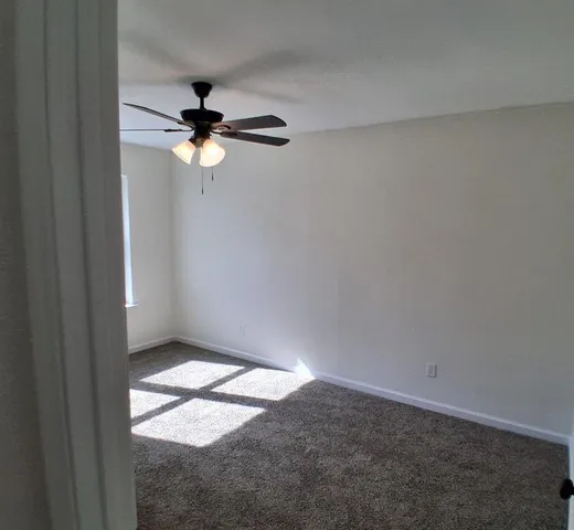 a view of a ceiling fan in a room