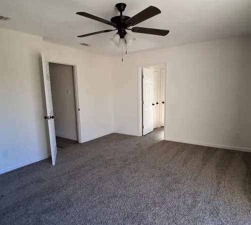 a view of a livingroom with a ceiling fan