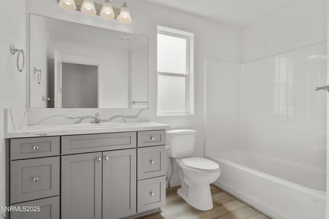 a bathroom with a toilet sink and a bathtub