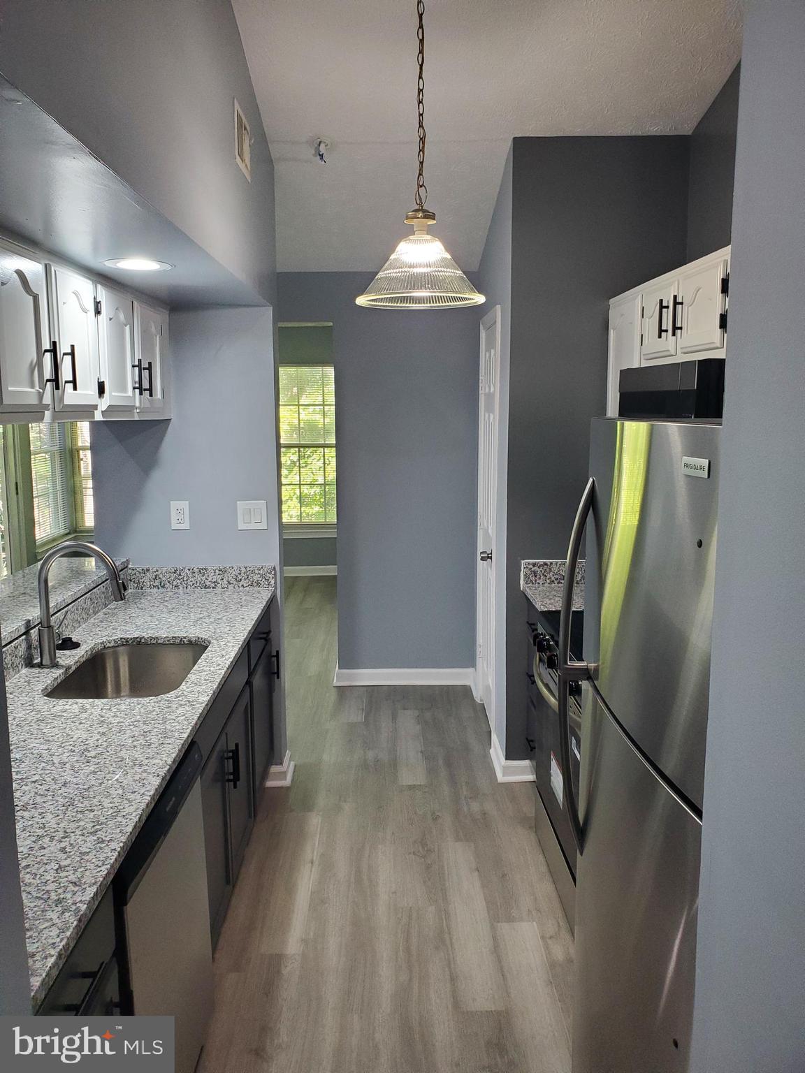1304 Clover Valley Way, Unit K Edgewood, MD 21040 - Photo 2 of 10 a kitchen with stainless steel appliances granite countertop a sink stove and refrigerator