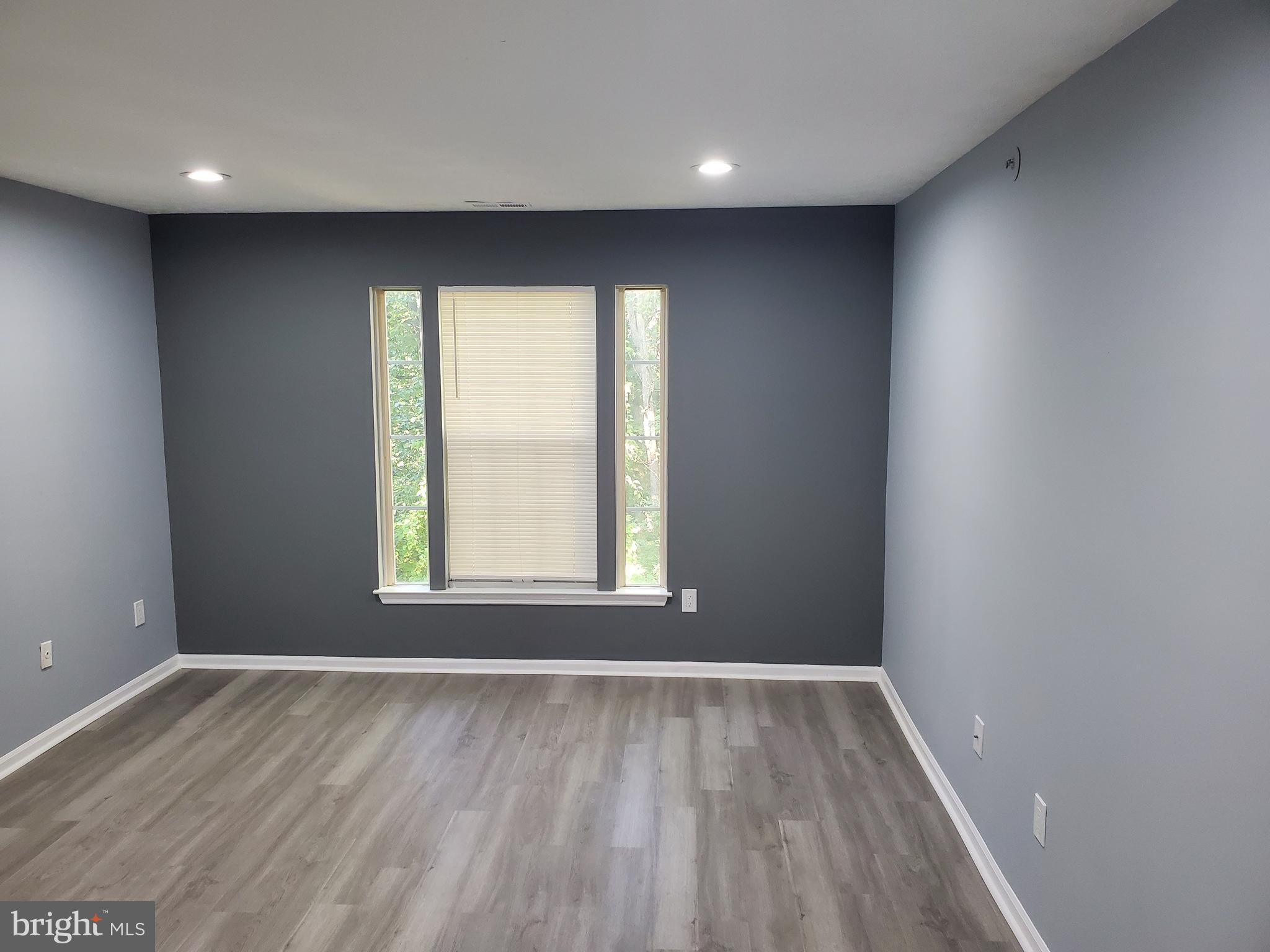 1304 Clover Valley Way, Unit K Edgewood, MD 21040 - Photo 6 of 10 wooden floor in an empty room with a window