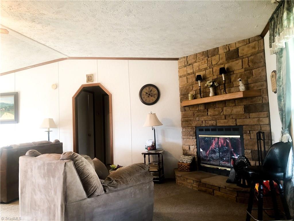 679 Mt Zion Road Pinnacle, NC 27043 - Photo 21 of 30 Den area and living room are open to each other