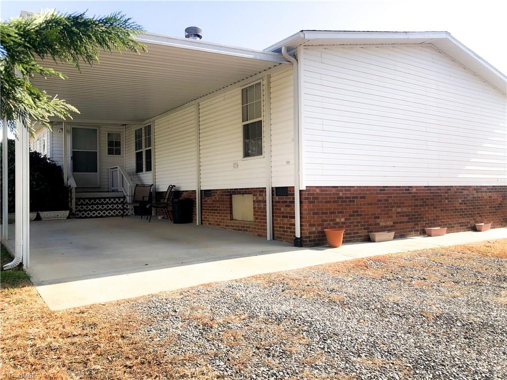 679 Mt Zion Road Pinnacle, NC 27043 - Photo 5 of 30 attached carport and enclosed porch.
