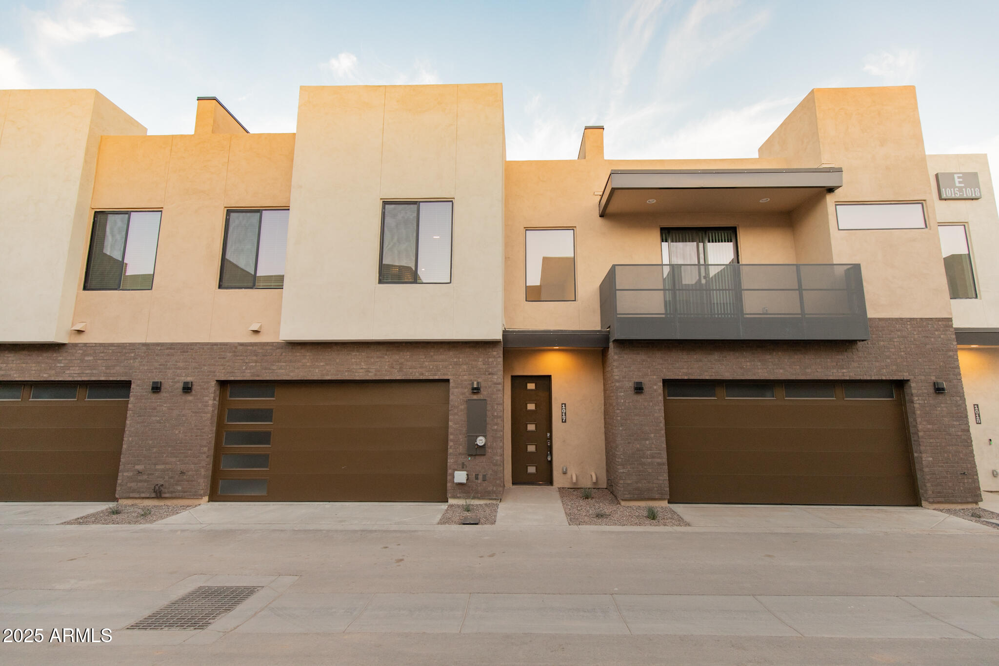 a front view of a house with a garage