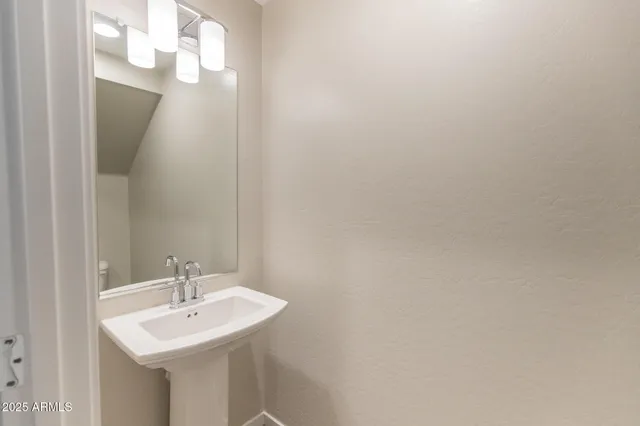 a kitchen with granite countertop a sink and a wooden floor