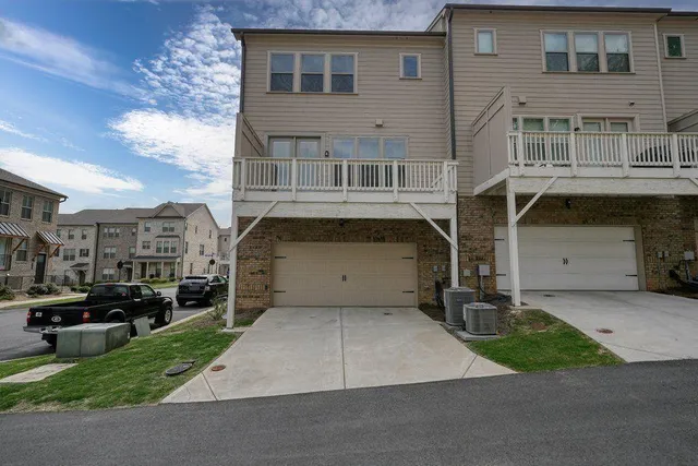 an aerial view of a house with swimming pool patio and outdoor seating