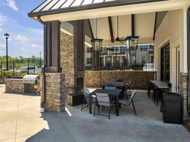 a swimming pool with outdoor seating