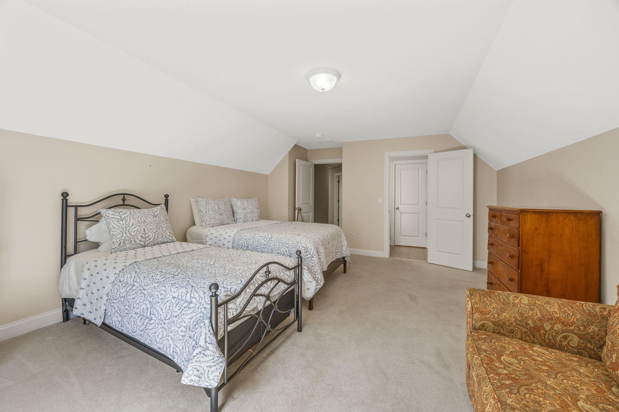 17 Payamps Road Mashpee, MA 02649 - Photo 56 of 72 a spacious bedroom with a bed and cabinet
