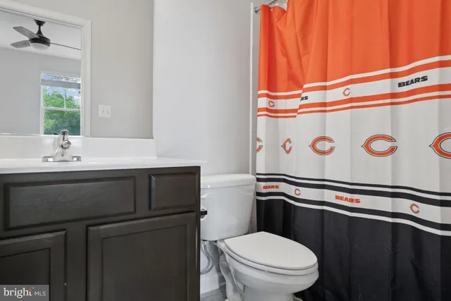 a spacious bedroom with a bed and a couch