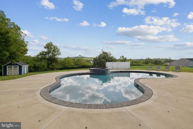 a view of a house with a yard and a slide