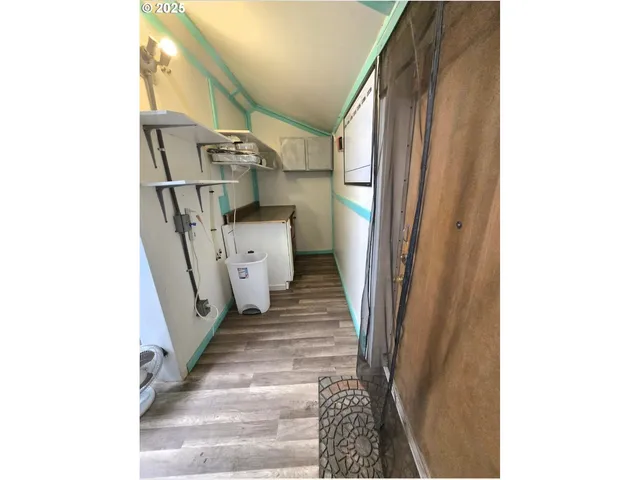 a view of a hallway with stairs