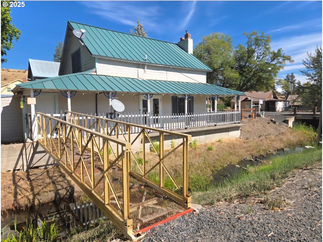 57036 Wamic Market Road Wamic, OR 97063 - Photo 2 of 31 a front view of a house with basket ball court