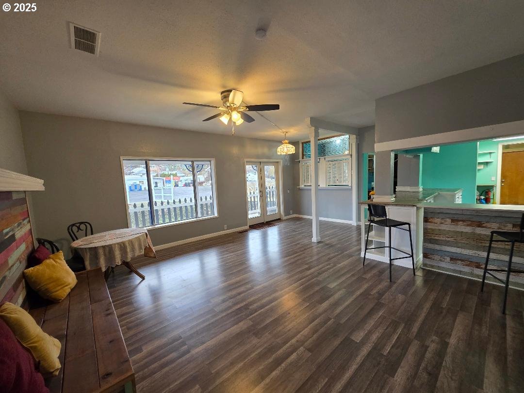 57036 Wamic Market Road Wamic, OR 97063 - Photo 3 of 31 a view of a livingroom with furniture hardwood floor and a ceiling fan