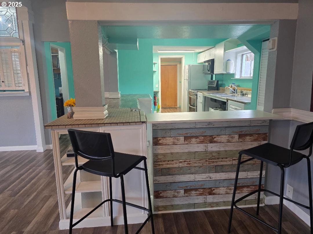 57036 Wamic Market Road Wamic, OR 97063 - Photo 9 of 31 a kitchen with a table chairs and a refrigerator