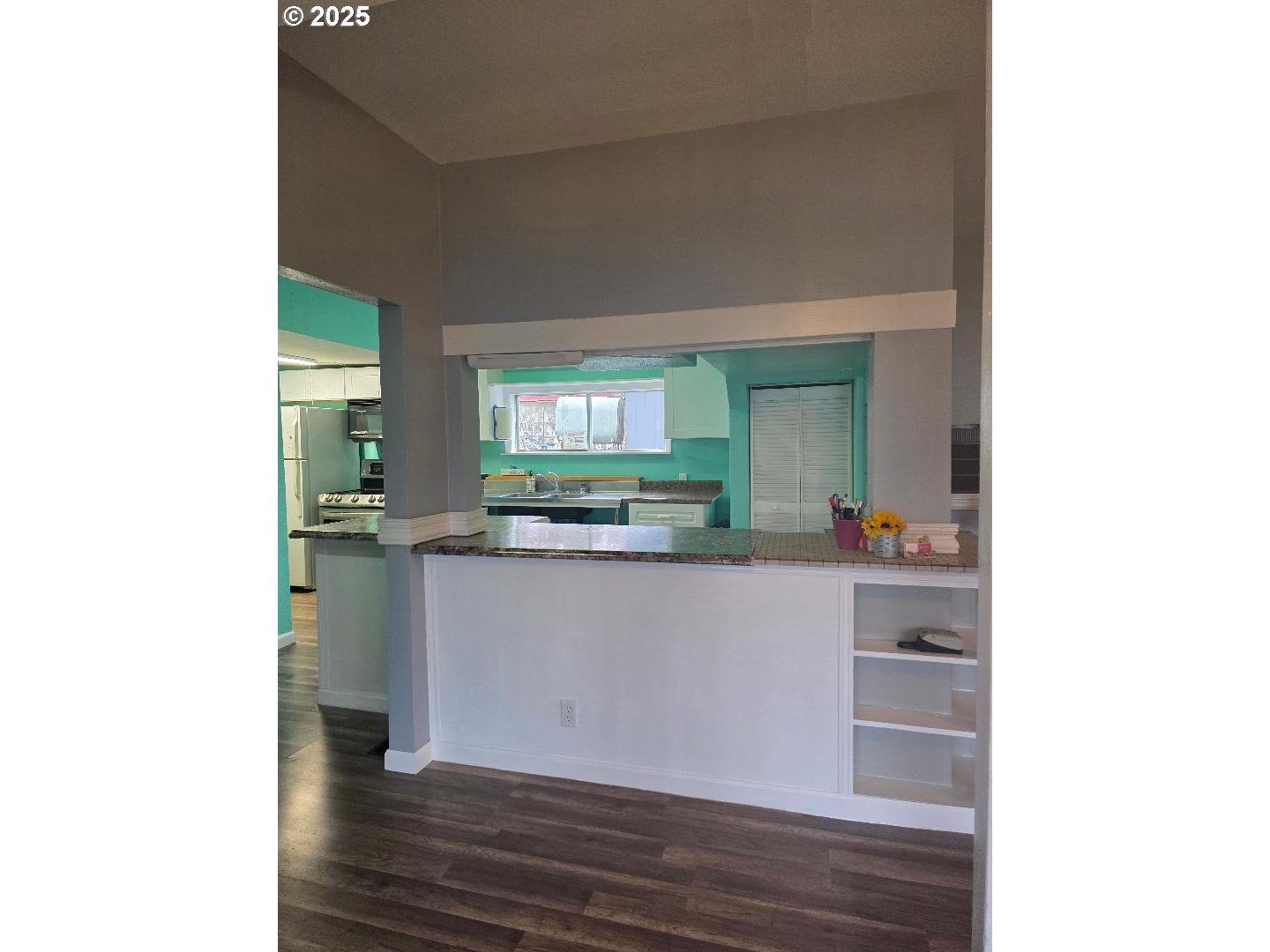 57036 Wamic Market Road Wamic, OR 97063 - Photo 10 of 31 a room with a wooden floor and cabinets