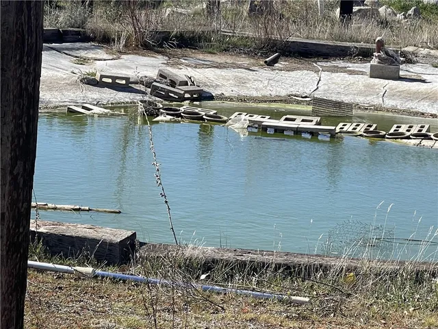 a view of swimming pool with a yard